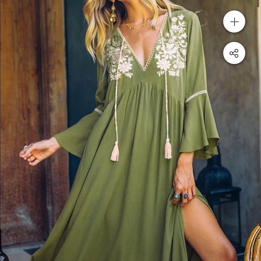 green midi dress, with embroidery designs